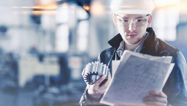 factory engineer checks the quality of the manufactured part